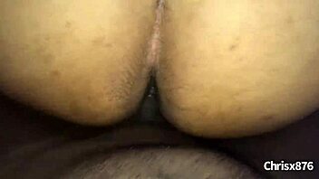 A Jamaican man fucks a black woman doggy style