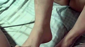 Wife gives footjob and receives cum on her pussy in dog style