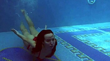 Lina Mercury, a Russian pornstar with big breasts, indulges in swimming pool fun