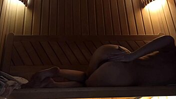 Girl with perfect figure pleasures herself in sauna with pink dildo, squirting hard