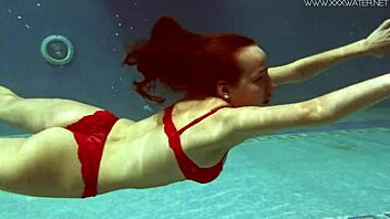 Lina Mercury, a Russian pornstar with big breasts, indulges in swimming pool fun