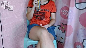 Why is this Asian girl painting her naked body with lipstick?