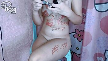 Why is this Asian girl painting her naked body with lipstick?