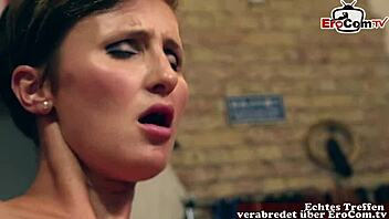 A German model with short hair and big tits engages in sexual activity in a public shopping mall