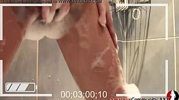 Petite European woman indulges in solo fingering session in the bathroom