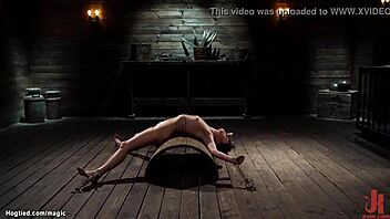 Rough slave bound on half barrel endures kinky bdsm with deepthroat and choking in bizarre fetish scene