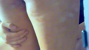 A young couple engages in passionate lovemaking while being recorded on camera