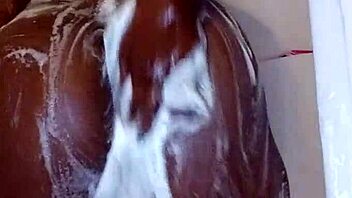 Wet ebony milf rubs her big ass solo