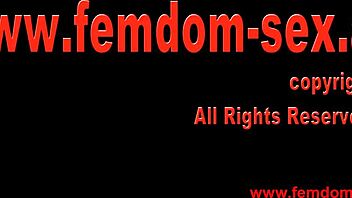 german femdom licks pussy in bdsm fetish scene.
