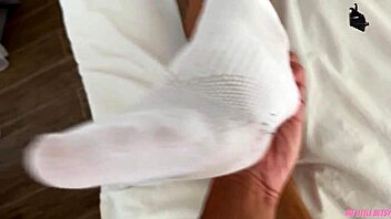 Stepbrother ejaculates while performing foot fetish acts on me
