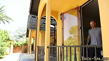 Massaging a teen redhead in bikini with small tits and heels