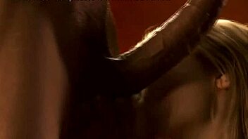 The Asian woman is giving deep oral pleasure to her interracial lover during massage