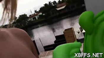 A teen babe shares attention with a lad