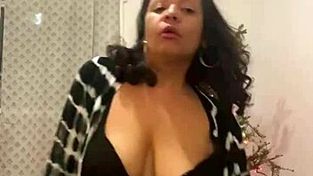 Sultry Latina MILF with big tits seduces in a Christmas-themed dance video
