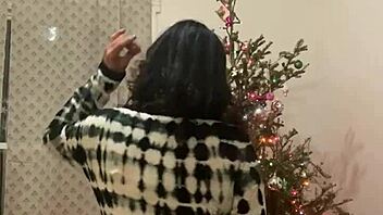 Sultry Latina MILF with big tits seduces in a Christmas-themed dance video