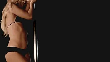 Shakira shows off her pole dancing skills in a bikini
