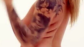 Blonde in fishnets and stockings relaxes with intense shaved pussy play.