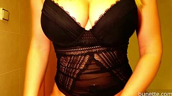 Amateur woman in a bodysuit with large breasts and a butt plug