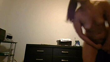 petite brunette with small tits does public show in front of window.