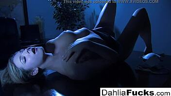sexy dahlia fingers herself in the dark room.
