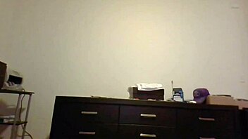 petite brunette with small tits does public show in front of window.