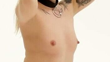 Blonde in fishnets and stockings relaxes with intense shaved pussy play.