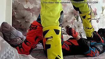 motocross biker in costumes treads boots suggestively
