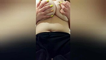 A curvy girl with yellow nails and black pants pleases her large nipples on camera - intense ecstasy