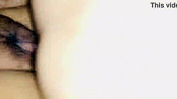 In a homemade setting, a teen's extreme tight creamy pussy gets fucked hard close up