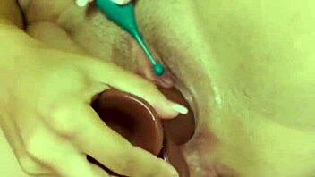 Horny close-up teasing of wet shaved pussy with dildos to orgasm