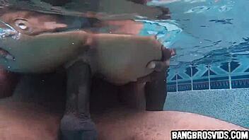 Cute petite Asian rides big black cock in pool?