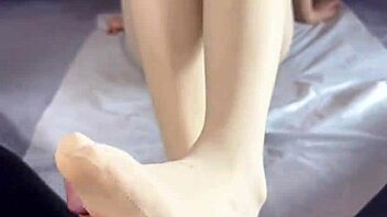 Friend's sister climaxes from pantyhose footjob