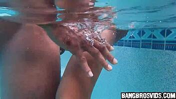 Cute petite Asian rides big black cock in pool?