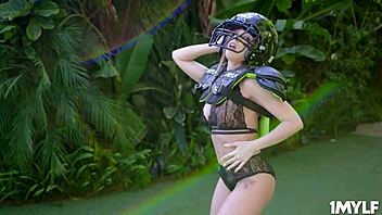 Mature beauty Britney Amber flaunts her voluptuous breasts while coaching football