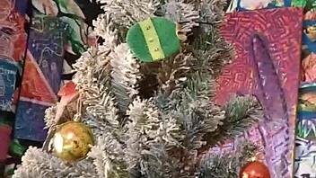 Petite babe unwraps Christmas toys for fingering fun