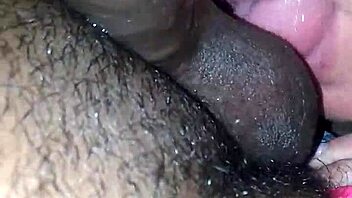 Pretty blonde slut expertly sucking a massive black cock