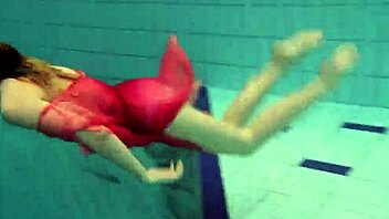 Voluptuous Russian teen Duna flaunts her firm assets in a red dress