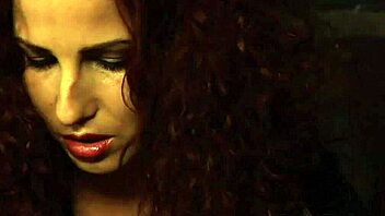 betrayed cargo lesbian tied in chains and groped by the dominant madame in this femdom scene