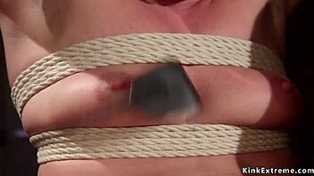 brunette beauty gets ass paddled and fucked in bondage