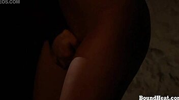 betrayed cargo lesbian tied in chains and groped by the dominant madame in this femdom scene