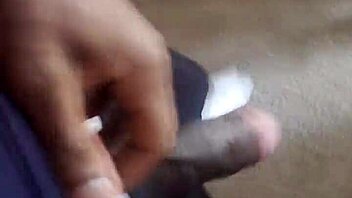 Twink flaunting his large ebony shaft to all his condominium neighbors
