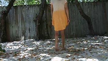 Mature woman pees outdoors with keys