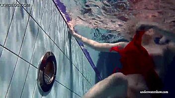 Russian teen 18+ Lucie strips naked for underwater swimming in pool