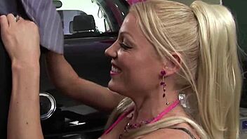 Blonde Aspires to Be Car Mechanic but Excels at Blowjobs in Leather and Fishnets. She Takes It Hard with Cum on Her Ass.