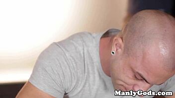 Muscular gay hunks get close while banging and stroking