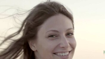 Petite and beautiful Talia Mint pleasures herself on the public beach