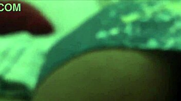 Sultry curly-haired beauty teases with her ass and feet in dorm room