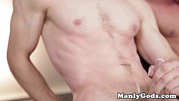 Muscular gay hunks get close while banging and stroking