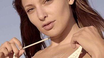 Petite and beautiful Talia Mint pleasures herself on the public beach