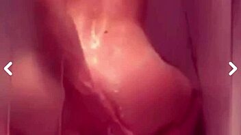 A playful vixen trims her intimate area before indulging in a refreshing bath